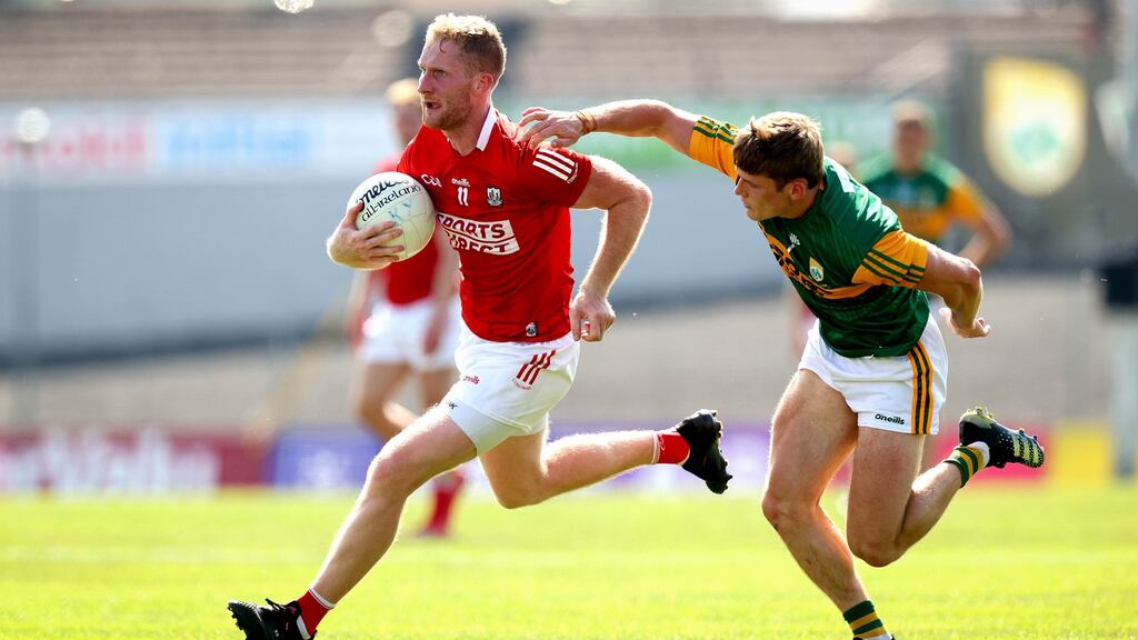 Kerry’s Gavin White and Ruairi Deane of Cork playing in last year’s championship. Photograph: Ryan Byrne/Inpho