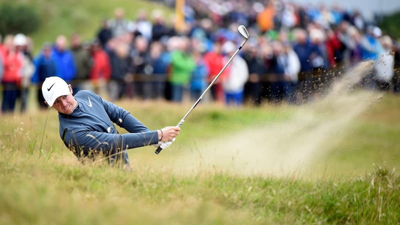 Rory McIlroy blasts out of a bunker during the second round of the British Open at Royal Birkdale. Photograph: EPA