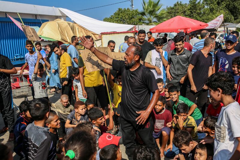 Displaced Palestinians demonstrate about a need for water and bread in a camp set up by UNRWA, the United Nations agency that aids Palestinians, in Khan Younis, in the southern Gaza Strip, on November 2nd. Photograph: Samar Abu Elouf/The New York Times