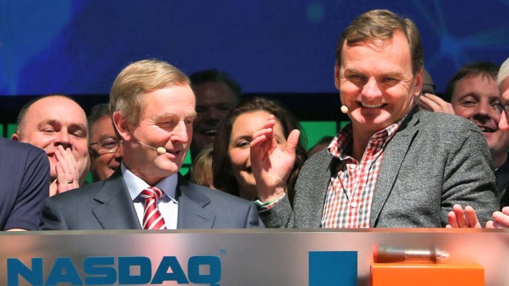Bruce Aust, executive vice-president of the global corporate client group at Nasdaq OMX, pictured with Taoiseach Enda Kenny at the Dublin Web Summit yesterday. Photograph: Colin Keegan/Collins Dublin