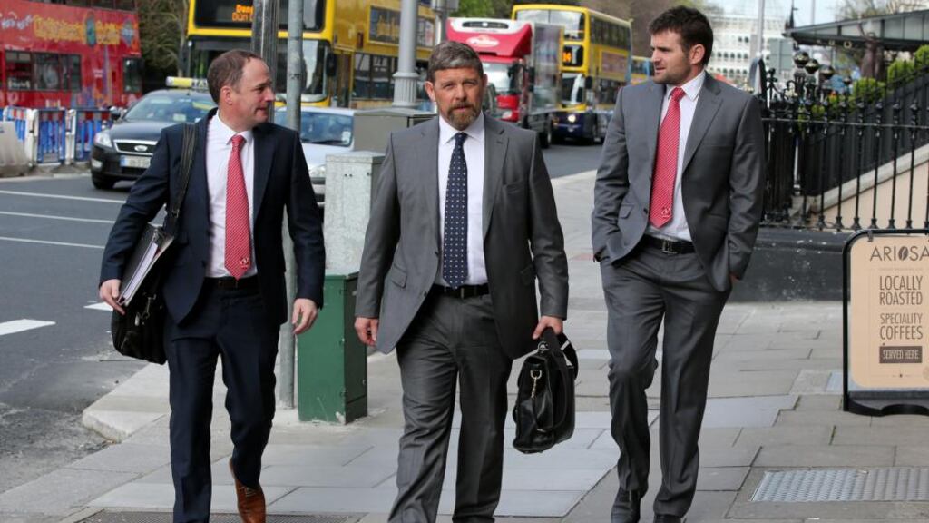 Ulster’s Director of Rugby David Humphreys, team manager David Millar and Jared Payne walking to the ERC offices. Photograph: Dan Sheridan/Inpho