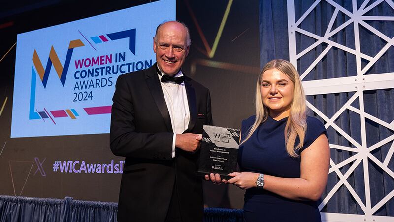 Richie Smith, business development director, BWDI Ltd., presents the excellence in project management award to Lily Rowntree, events lead, Business River, accepting on behalf of Babcock International