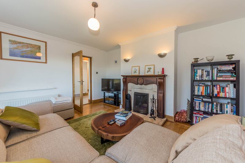 The owners retained the original sittingroom on the north side of the house; with an open fire, it makes a cosy retreat on winter evenings.