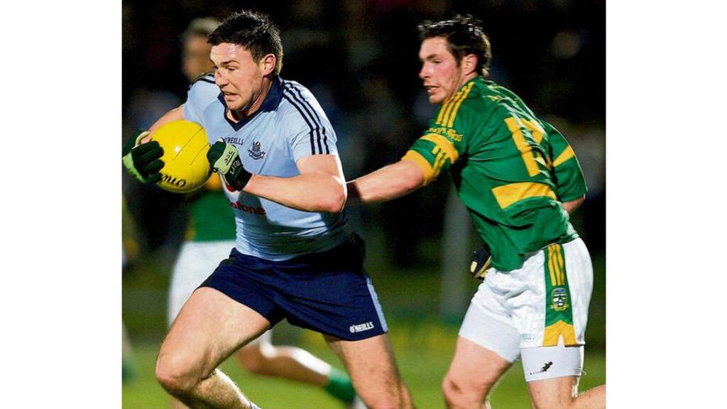 Dublin's Eamonn Fennell tries to break clear of Meath's David Bray during last night's O'Byrne Cup quarter-final replay at Páirc Tailteann in Navan. - (Photograph: Lorraine O'Sullivan/Inpho)