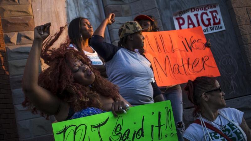 Residents demanding justice for Freddie Gray take part in a post-march celebration on the streets of west Baltimore on Saturday. Thousands of people took to the streets of Baltimore as anger over the death of a young black man turned to hopes for change following swift criminal charges against six police officers. Photograph: Reuters