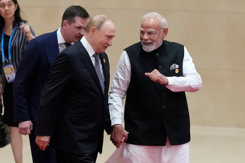 Indian prime minister Narendra Modi holds hands with Russian president Vladimir Putin during the Shanghai Co-operation Organisation summit. Photograph: Suo Takekuma/Pool/Getty Images