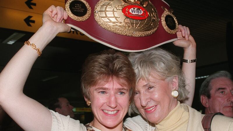 Deirdre Gogarty is welcomed by her mother Mrs Edie Gogarty after returning home to Ireland with her world title belt. Pic Paddy Whelan