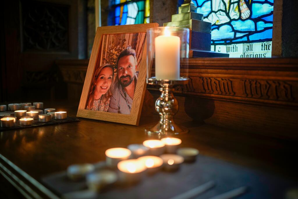 Candles illuminate a photo of Nicola Bulley and her partner Paul Ansell at St Michael's Church in St Michael's on Wyre, Lancashire, England, before her body was found in recent days. Photograph: Christopher Furlong/Getty