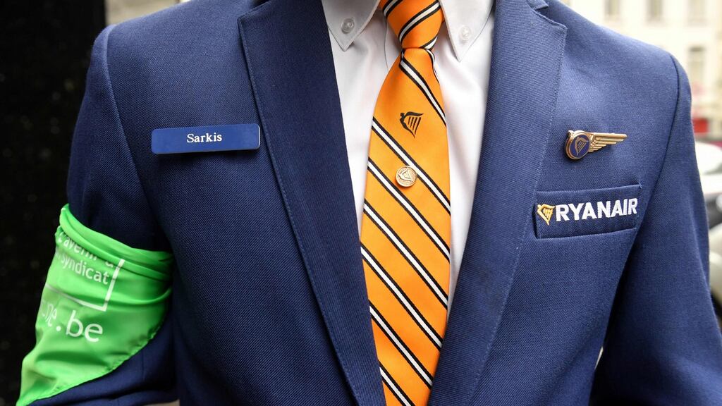 A Ryanair cabin crew member and union representative arrives ahead of a press conference held by Ryanair unions representatives on Thursday in Brussels. Photograph: Getty