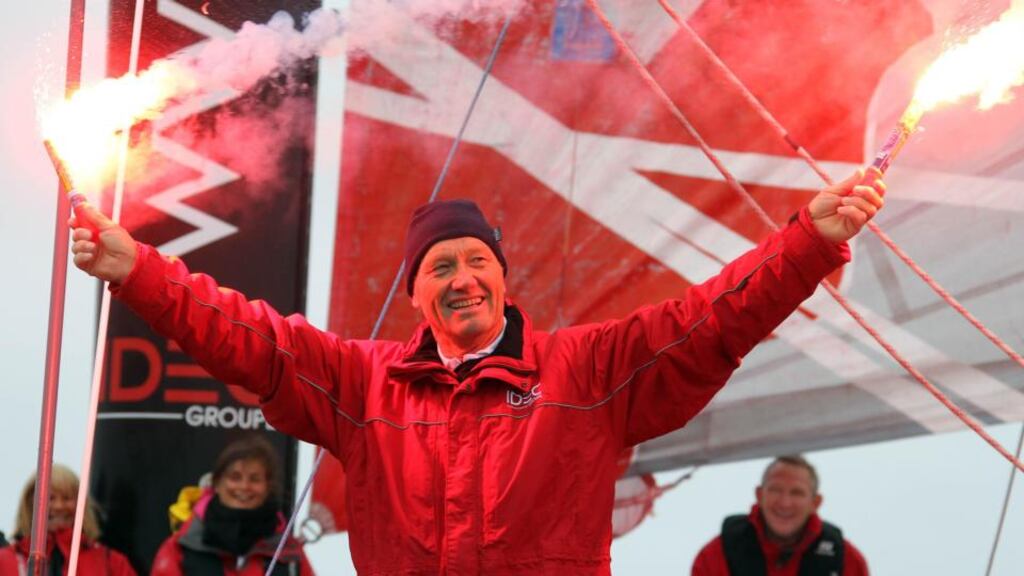 French skipper Francis Joyon of France celebrates aboard his Maxi IDEC Trimaran as he arrives in Brest, western France, Monday, June 17, 2013. Joyon broke the North Atlantic solo sailing record, finishing in 5 days, 2 hours, 56 minutes, 10 seconds, more than 16 hours and 34 minutes faster than the previous record. Racing his Maxi IDEC trimaran, the French skipper crossed the finish line at Lizard Point Sunday, June 16 to beat Thomas Coville's five year record. (AP Photo/David Vincent)