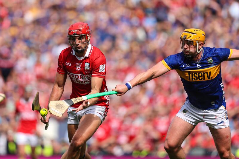 Cork's Ciaran Joyce is tackled by Tipperary captain Ronan Maher. Photograph: Bryan Keane/Inpho