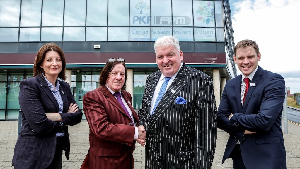 Feargal McCormack (second right) outside the new Balbriggan office which PKF-FPM bought from Francis J Woods & Company: pictured with Teresa Campbell, PKF-FPM staff director; Joe Woods; and Michael Farrell, PKF-FPM lead director for the new office