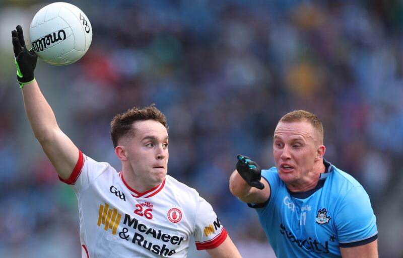 Tyrone's Eoin McElholm and Dublin's Ciarán Kilkenny. Photograph: James Crombie/Inpho
