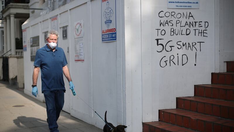Graffiti that reads “Corona was planted to build the 5G smart grid!” in Kensington, London. Photograph: Hannah McKay/Reuters