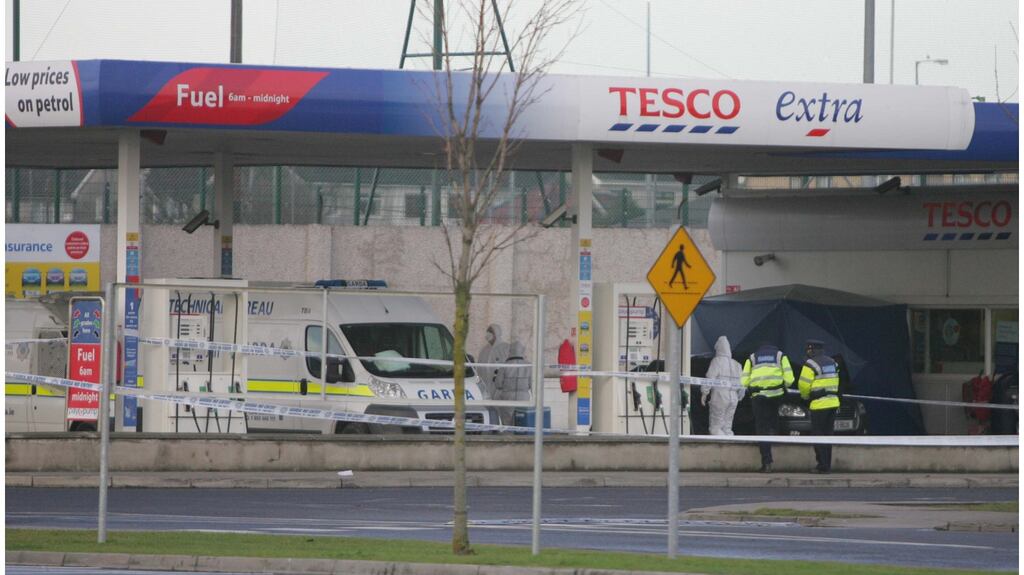 Gardaí at the scene of the fatal shooting of Mark Noonan and Glen Murphy at the Tesco Clearwater petrol station in Finglas in Dublin in 2010. Photograph: Bryan O’Brien