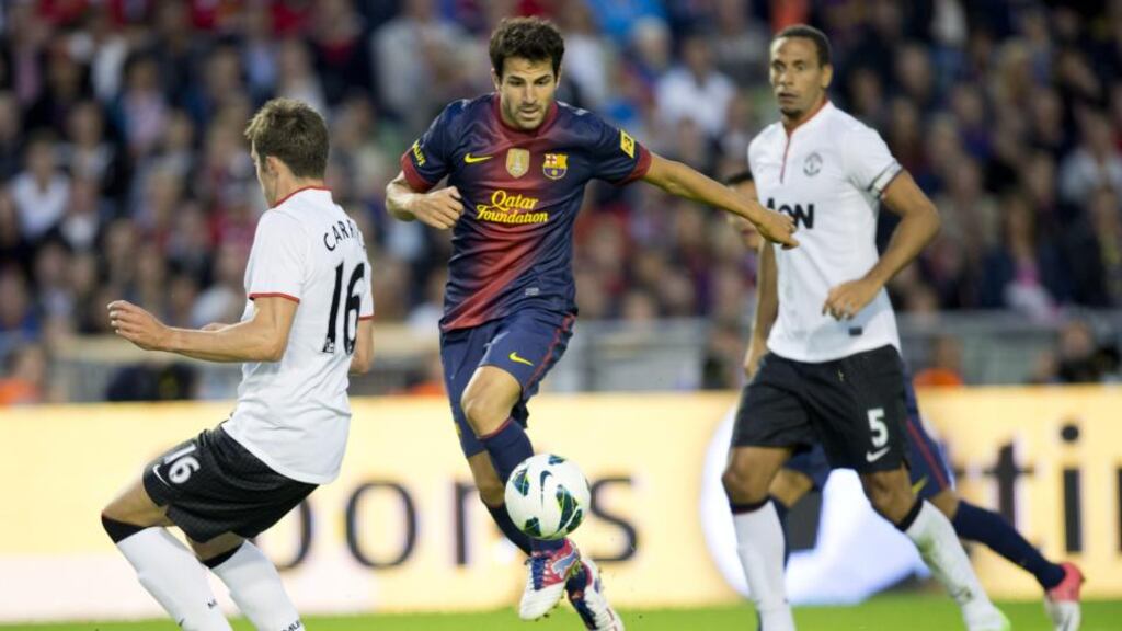 Cesc Fabregas in action against Manchester Unitede’s Michael Carrick and Rio Ferdinand during the sides’ friendly clash in Gothenburg last year. Photo: Blorn Larsson Rosvall/AFP/Getty