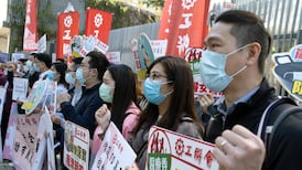 Coronavirus: British government calls for calm after eight schools closed