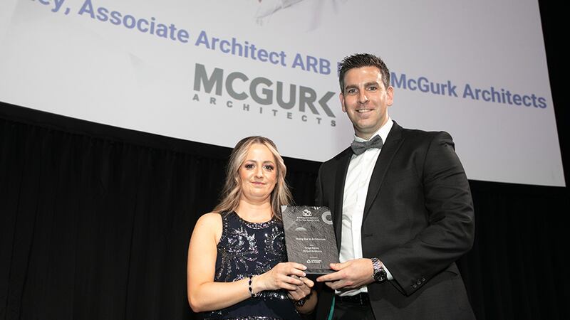 Lisa Cullen, Sales Director, Aperture Glazing, presents the Rising Star in Architecture award to Fergal Rainey, McGurk Architects.