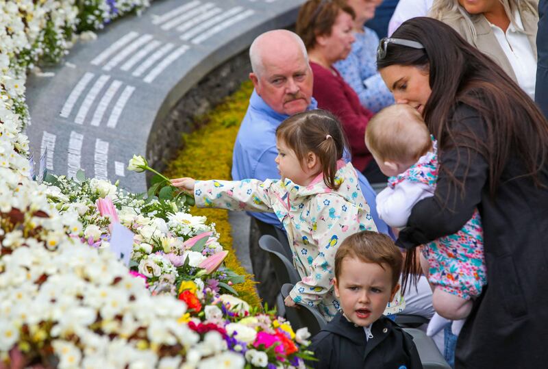 Floral tributes are laid in the memorial garden during the service on Sunday. Photograph: Paul Faith/AFP via Getty Images