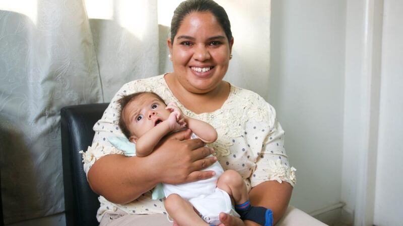 Graciela Romero holds her four-month-old son Joel. She survived pre-eclampsia while her aunt died. Photograph: Kait Bolongaro