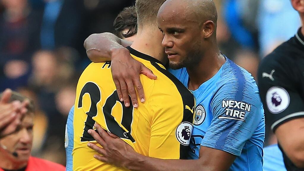 Burnley’s   goalkeeper Joe Hart   and Manchester City’s captain Vincent Kompany embrace at the end of City’s 5-0 victory at  the Etihad Stadium. Photograph: Lindsey Parnaby/AFP