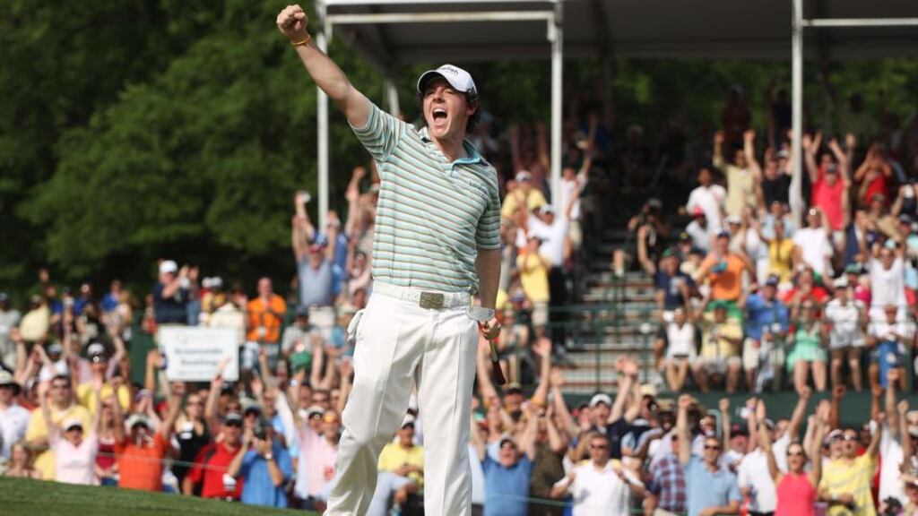 Rory McIlroy celebrates as he holes a birdie putt on the 18th green to secure victory at the 2010 Quail Hollow Championship in North Carolina. Photograph: Scott Halleran/Getty Images