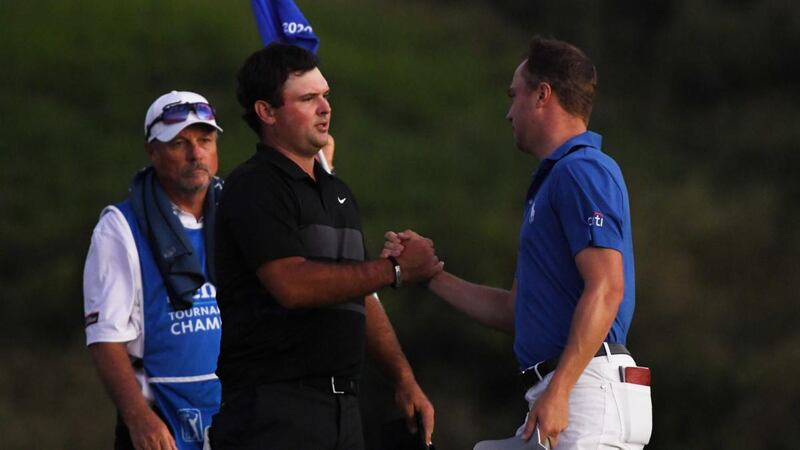 Patrick Reed congratulates Justin Thomas after his play-off victory. Photograph: Harry How/Getty