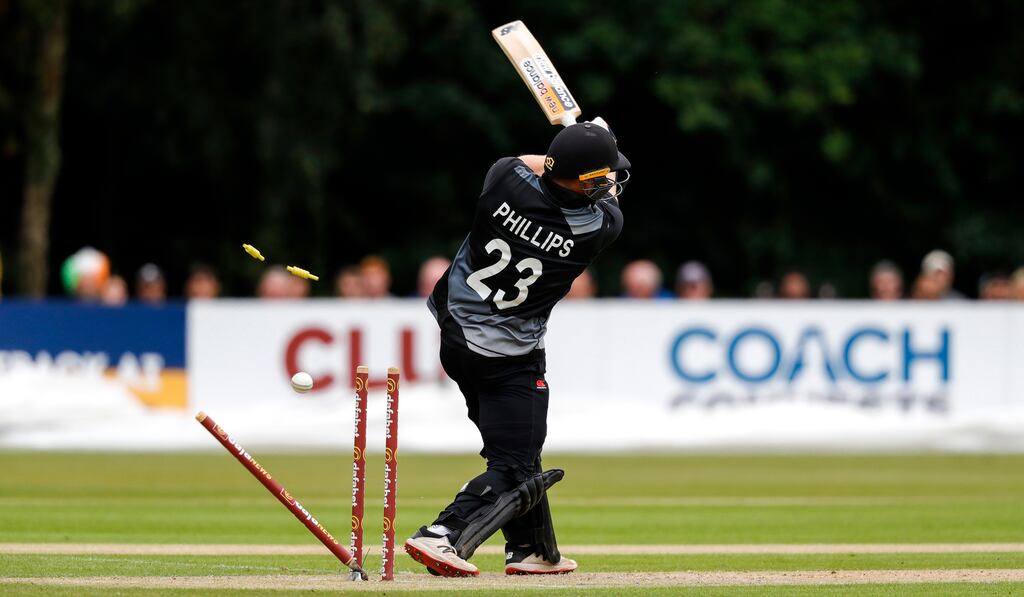 New Zealand's Glenn Philips is bowled by Ireland's Craig Young during the second T20 International at Stormont in Belfast. Photograph: Ben Whitley/Inpho