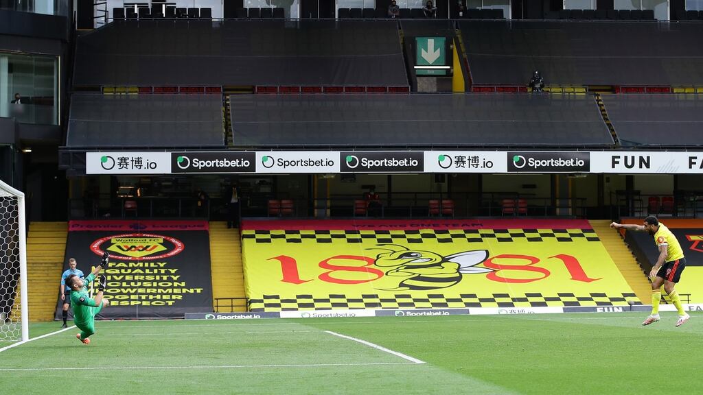 Troy Deeney of Watford scores his second goal from the spot during the English Premier League match between Watford and Newcastle United. Photo: Richard Heathcote/NMC/Pool