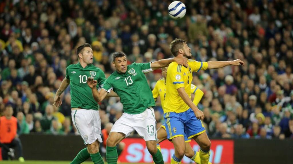 Republic of Ireland’s Robbie Keane and Jon Walters with Per Nilsson of Sweden. Photograph: Inpho
