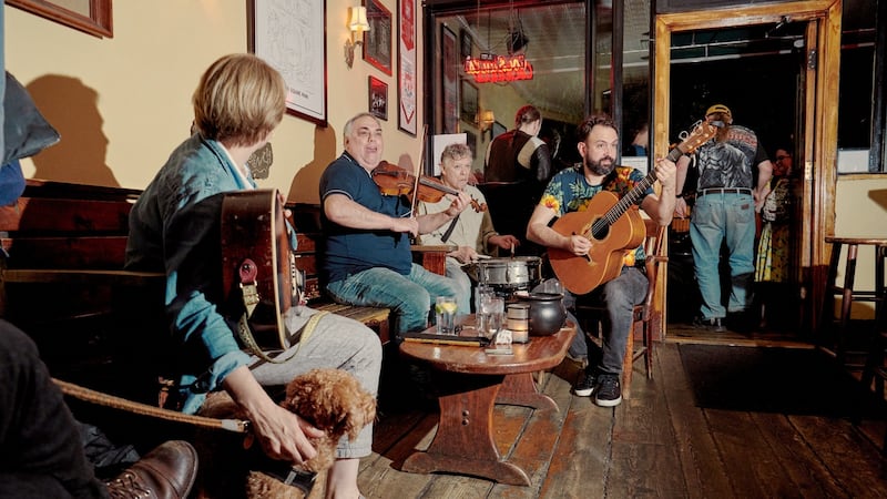 From left: Tony DeMarco, Arthur DeMeo, and Matt Diaz play at the 11th St Bar in New York. Photograph: Vincent Tullo/The New York Times