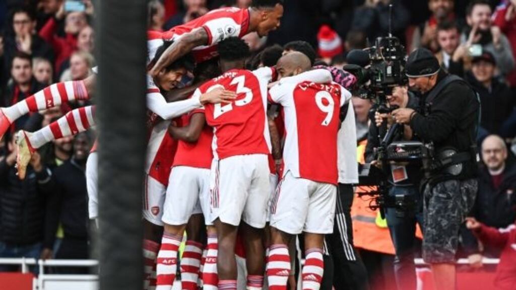 Arsenal’s Emile Smith Rowe celebrates with teammates after scoring the winner in their Premier League match against Watford. Photo: Facundo Arrizabalaga/EPA