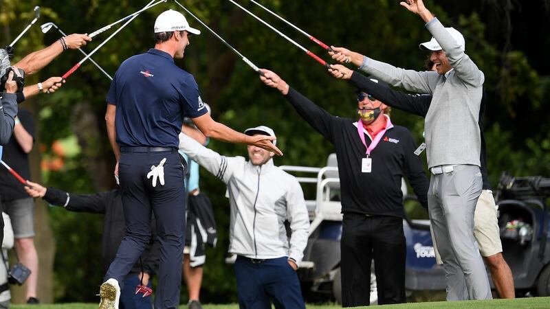 Renato Paratore of Italy receives a guard of honour from fellow European Tour professionals after winning the British Masters at Close House Golf Club. Photograph: Ross Kinnaird/Getty Images