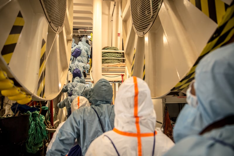 Some of the 73 people found at sea by MSF's Geo Barents disembark in Ravenna, Italy. Photograph: Sally Hayden
