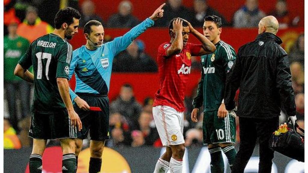 Manchester United's Nani shows his disbelief after receiving a red card from referee Cuneyt Cakir during the Champions League match at Old Trafford. photograph: martin rickett/pa