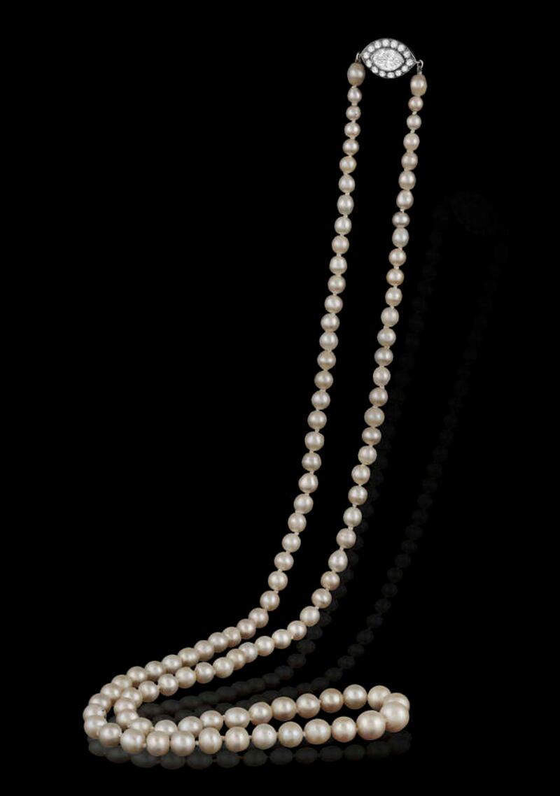 An early-20th-century pearl necklace with diamond clasp, circa 1920