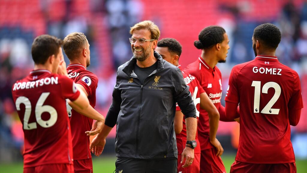 Liverpool manager Jurgen Klopp celebrates with players after their 2-1 win over Tottenham at Wembley. Photograph: Dylan Martinez/EPA