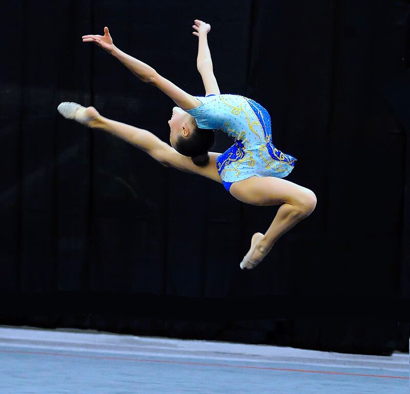 Natalie McGiffert doing a stag leap