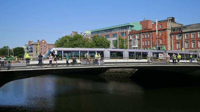 A tram crossing the Rosie Hackett Bridge which was specially built for the Luas in 2014. Photograph Nick Bradshaw