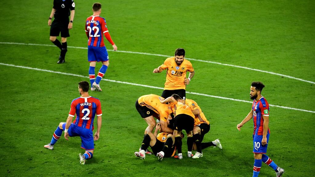 Wolves’ Jonny celebrates with his teammates after scoring their second during the Premier League win over Crystal Palace. Photo: Richard Heathcote/NMC/Pool