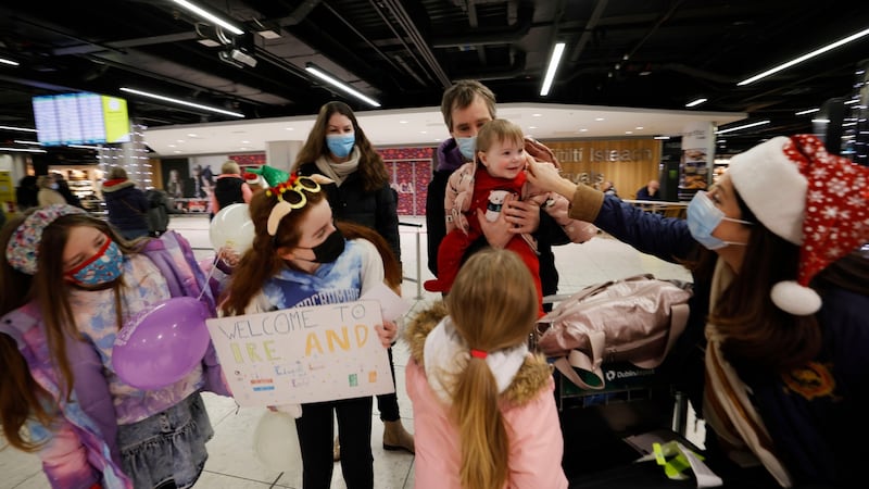 Edward Lynch and Leonie Kosters, and baby Emily, arriving from the Netherlands, are greeted by Edward’s sister Janet Lynch (right) and nieces Eva, Cliona and Hannah from Sutton. Photograph: Alan Betson