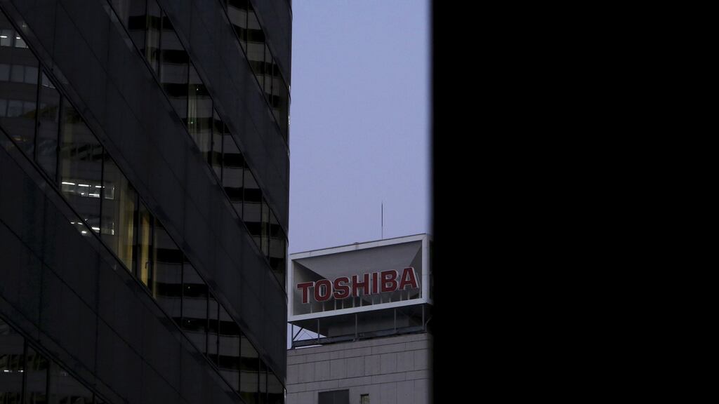 Toshiba also raised its earnings estimates for the year ended in March as it booked a pretax profit of 590 billion yen from the sale of a medical equipment division to Canon. (Photograph: Juya Shino/Reuters)