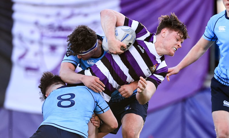 Terenure’s Daniel Martin is tackled by Sam Corrigan of St Michael's. Photograph: Nick Elliott/Inpho