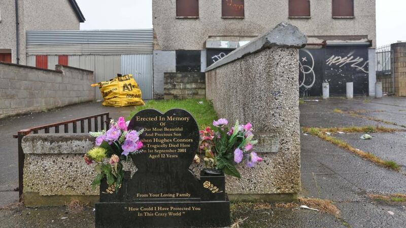 A stone marks the scene of the death of  Stephen Hughes  on Rossfield Avenue, Tallaght. Stephen was aged 12 in 2001 when he died in the fire in a makeshift den where he had been sleeping overnight. Photograph: Colin Keegan/Collins