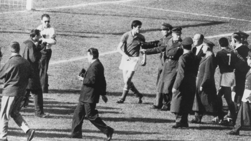 Police officers restrain Italian player Salvatore during the Battle of Santiago. Photograph: Keystone/Hulton Archive/Getty