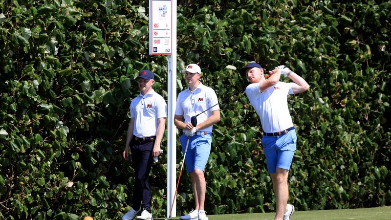 John Murphy plays a shot as Mark Power and Angus Flanagan look on during Tuesday’s practice round. Photo: Sam Greenwood/R&A/R&A via Getty Images