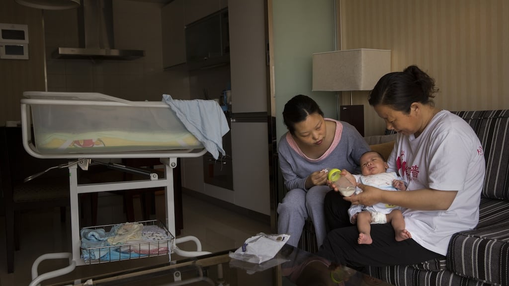 A mother (left) and her postpartum nanny in Beijing. Photograph: Adam Dean/The New York Times
