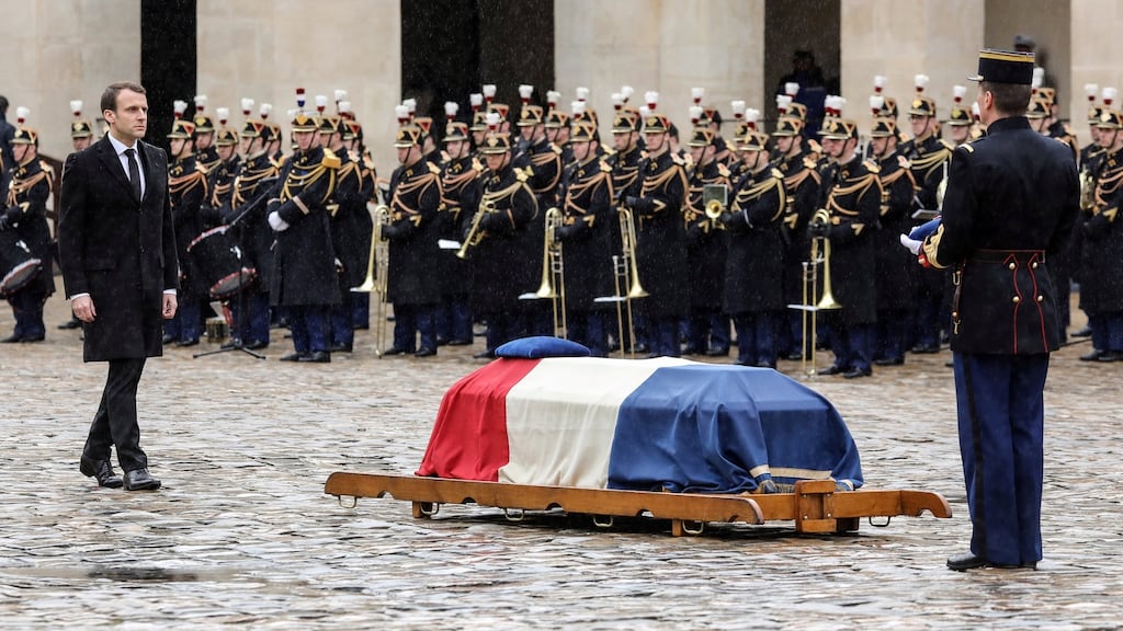 French president Emmanuel Macron walks towards the coffin of Arnaud Beltrame at the Hótel des Invalides in ParisPhotograph: Ludovic Marin/Pool via Reuters