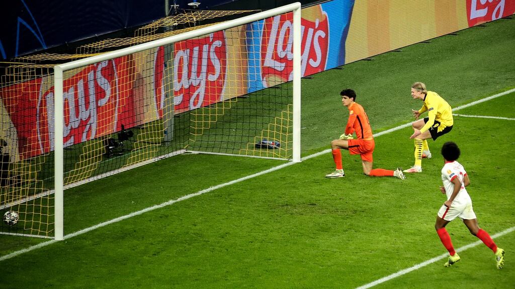 Borussia Dortmund’s Erling Haaland celebrates in front of Sevilla goalkeeper Yassine Bounou after scoring the second in their Champions League last-16 win. Photo: Friedemann Vogel/EPA