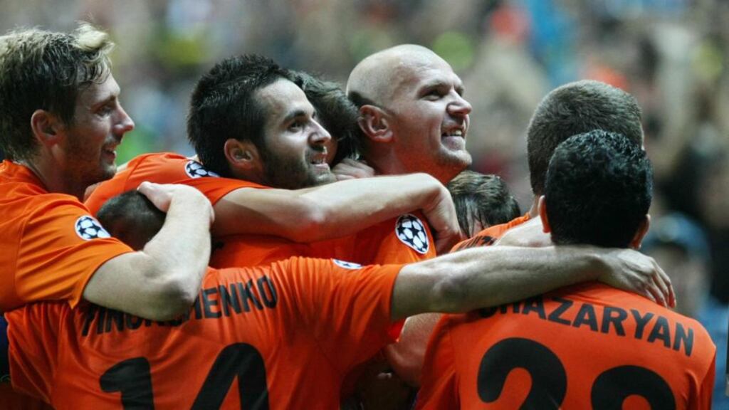 Shakhter’s players celebrate their second goal against Celtic during the first leg